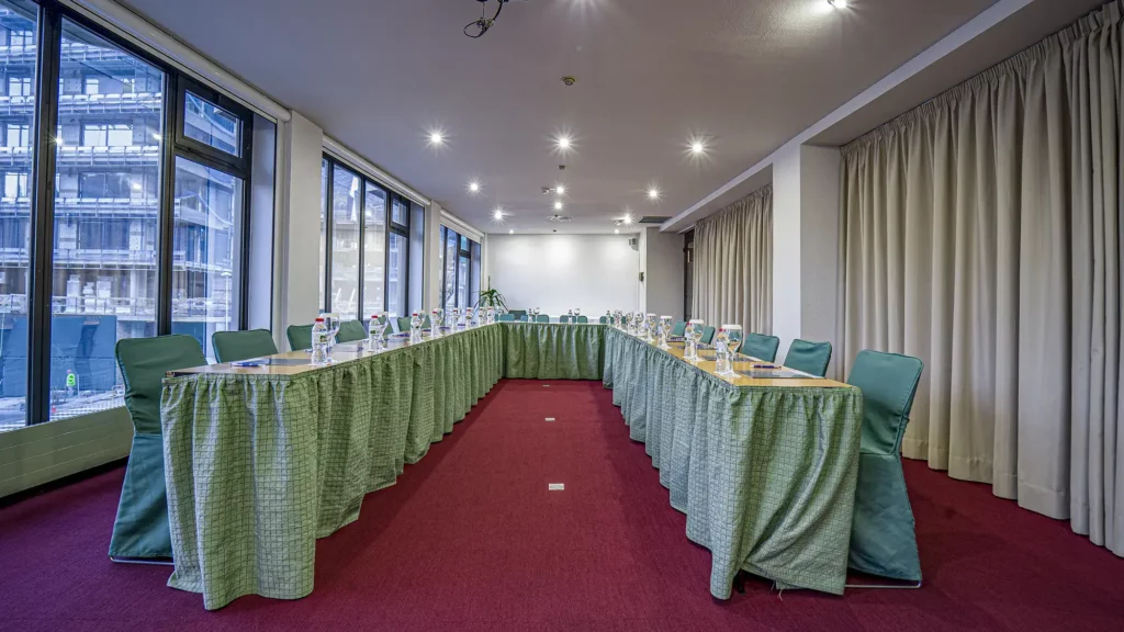 meeting room with big windows and bottles of water - roc blanc hotel & spa andorra