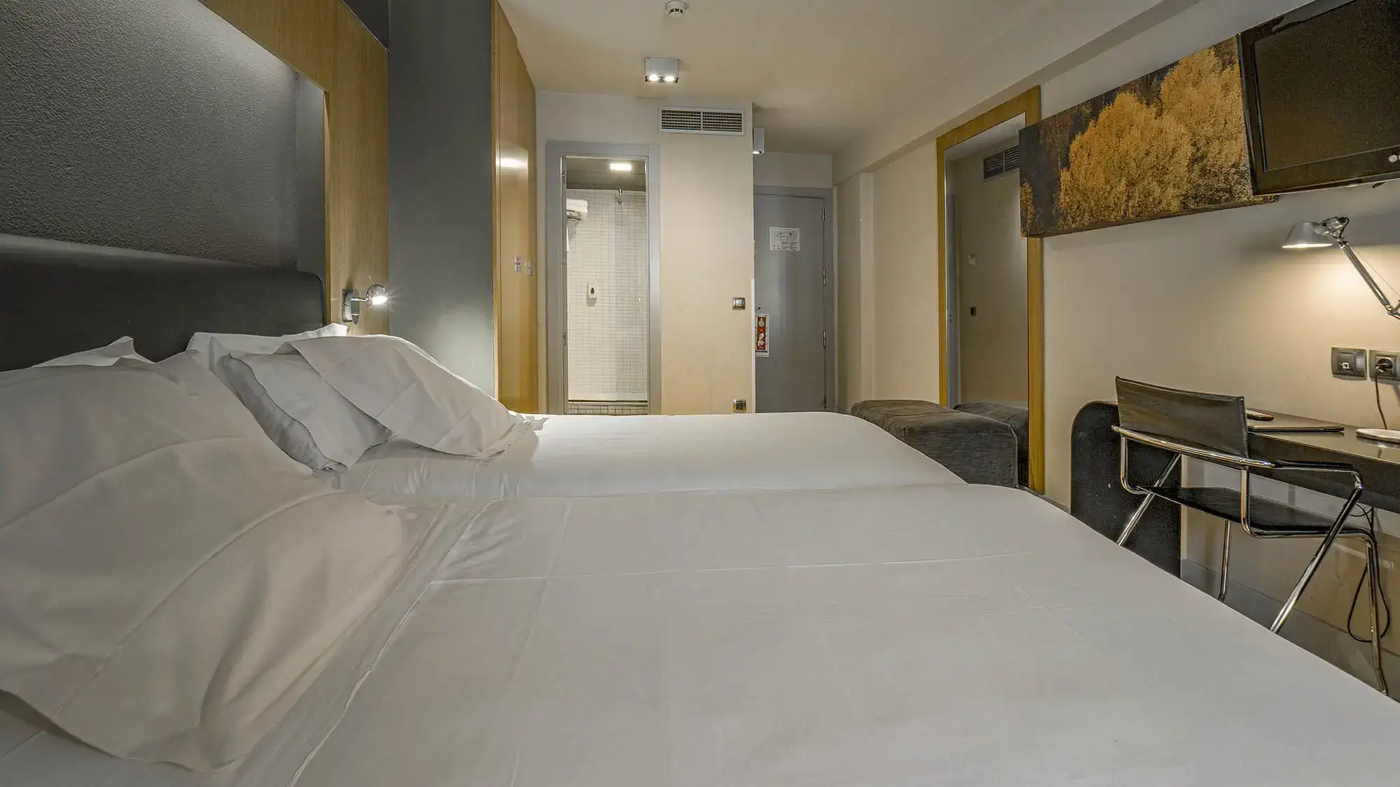 double room with double bed and calm interior - standard room- roc blanc hotel & spa andorra