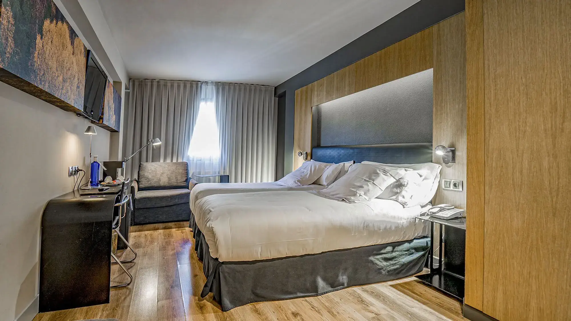 double room with double beds and dark colors - standard room- roc blanc hotel & spa andorra