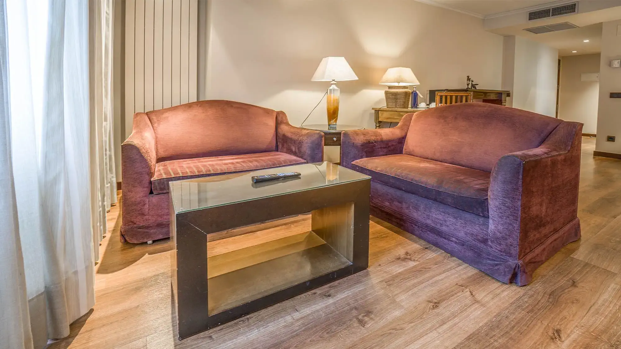 two couches in hotel room - deluxe room- roc blanc hotel & spa andorra